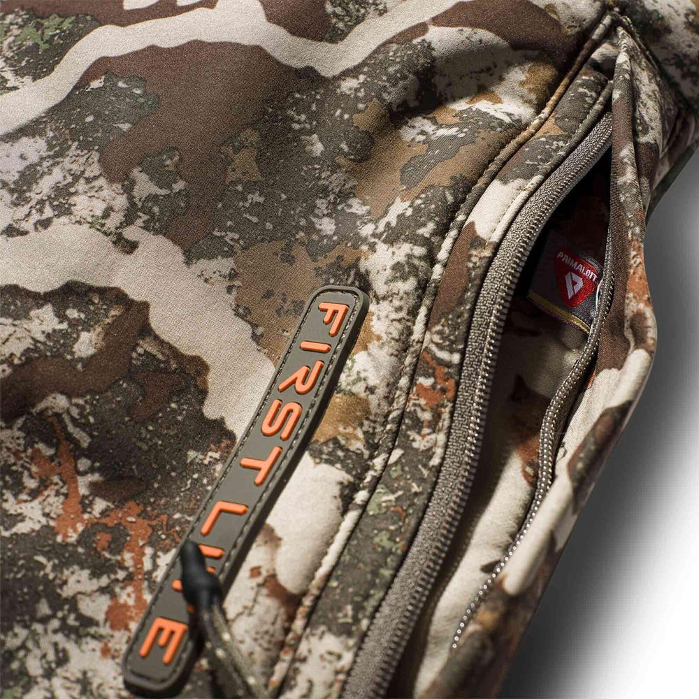 First Lite Thermic Muff interior sherpa lining, soft warmth for long hunts.