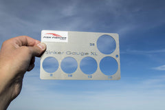 Fish Fighter XL Sinker Gauge in use helps organize cannonball weights.