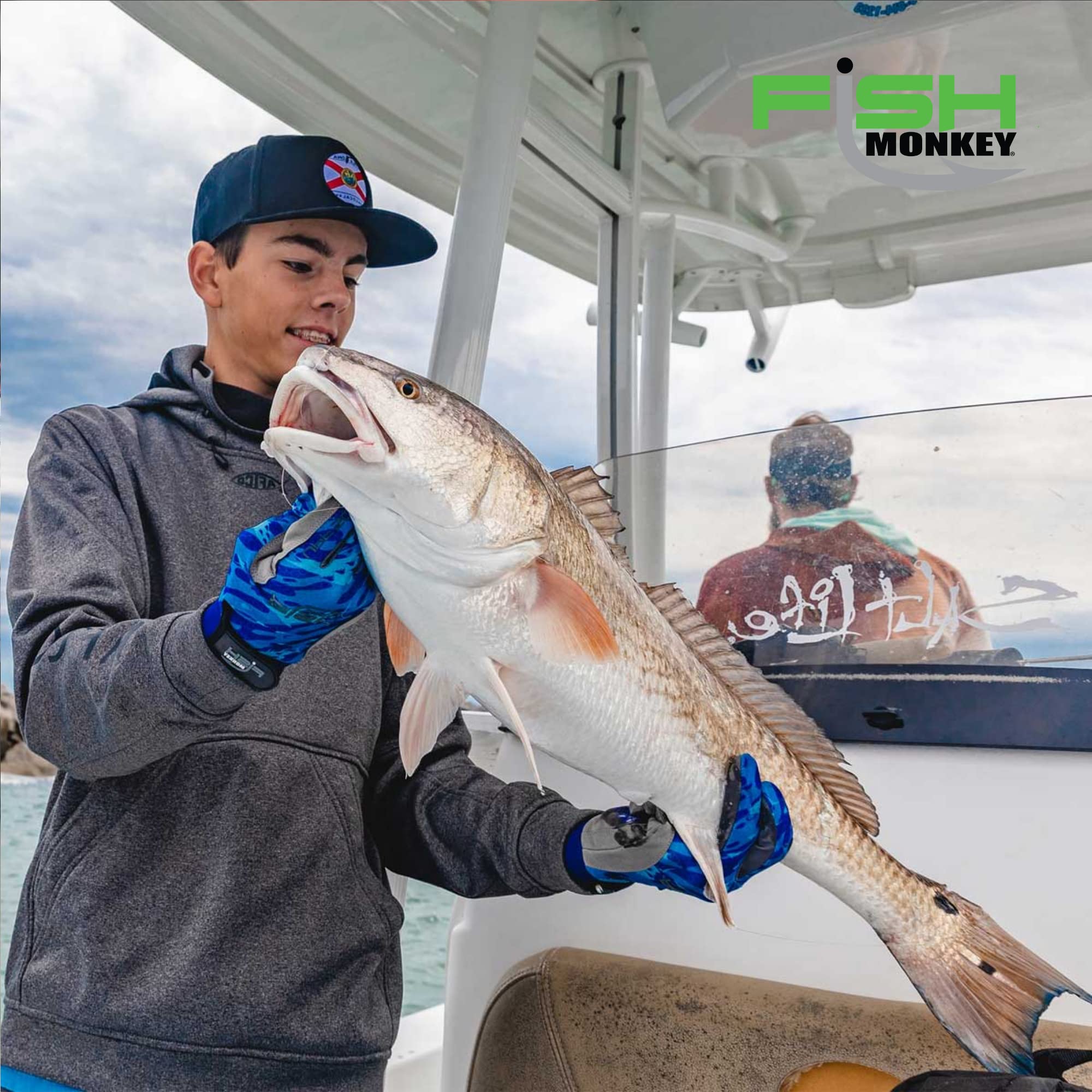 Fish Monkey Free Style Glove worn on a boat for reliable fishing gear.