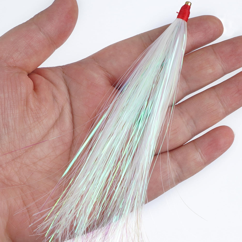 Multiple teaser rigs displayed with jigs and soft plastics
