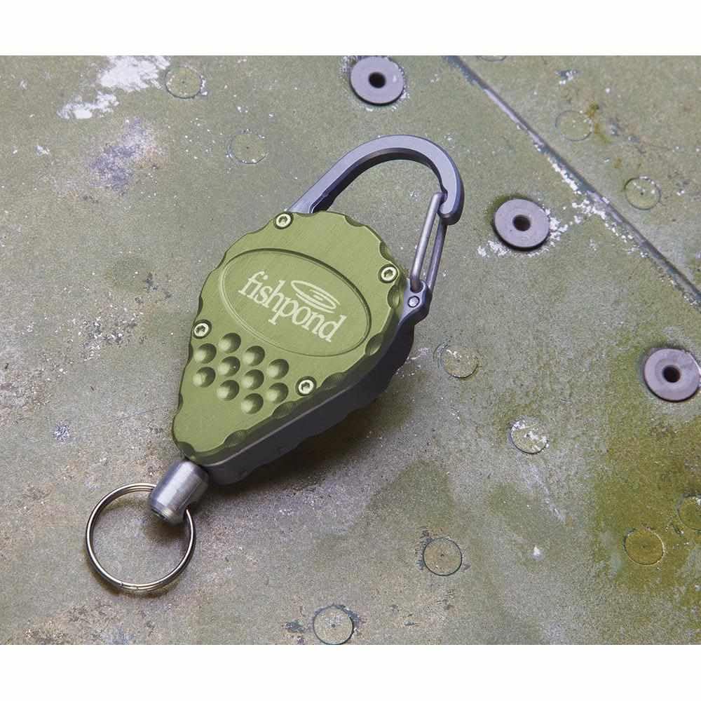 fishpond Arrowhead retractor extended by a 33-inch cord for on-the-water reach.