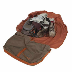 Interior view showing rolled waders and boots secured in the mat and bag