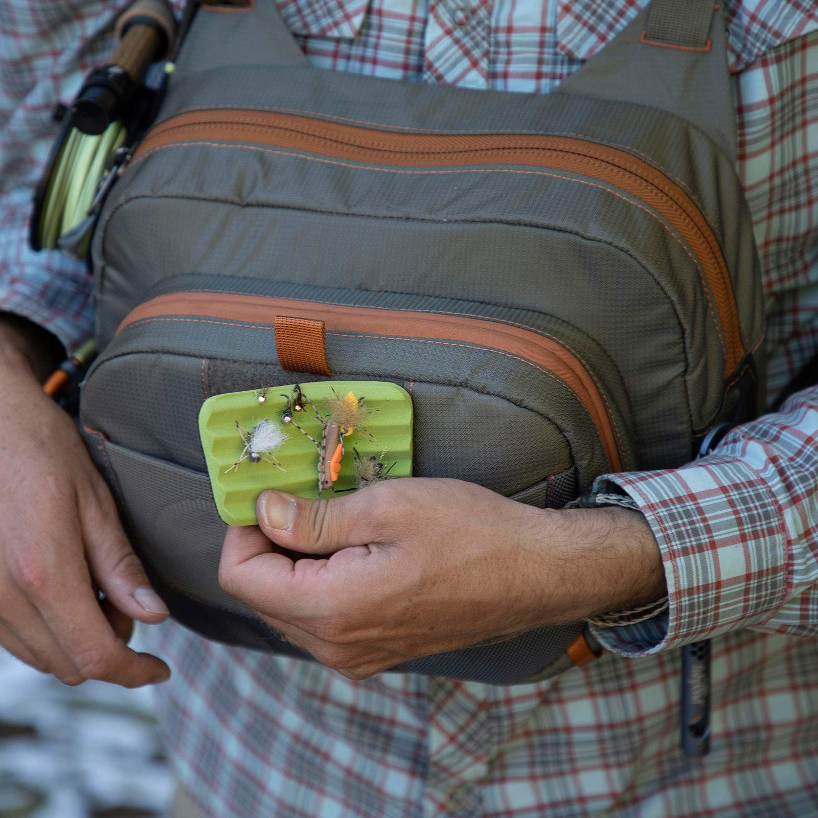 fishpond Cross-Current Chest Pack backpanel shows integrated net pass-through and release options