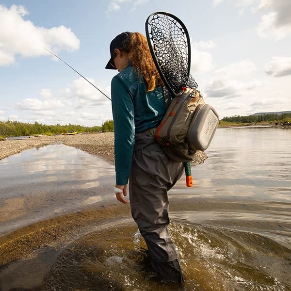 fishpond Summit 2.0 sling pack back with net sleeve supports easy storage while casting.