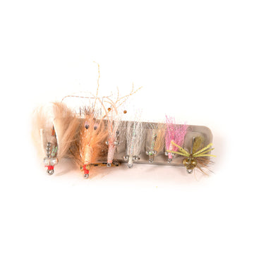 Durable recycled polycarbonate base supports fly storage on packs, boats, or workstations.