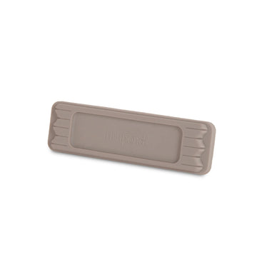 Fold-over Velcro strap securing MagPad to exterior patch