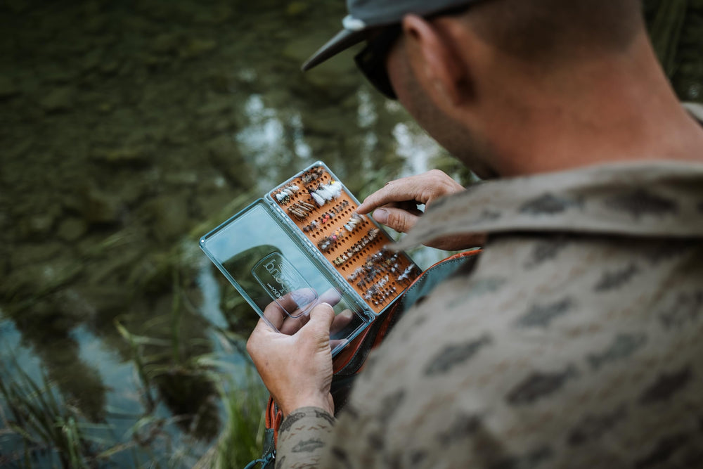 Durable materials of Fishpond Tacky Original Fly Box in rugged use imagery