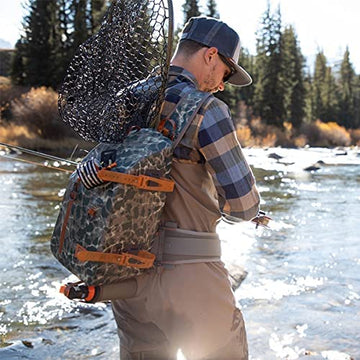 fishpond Thunderhead worn on river, demonstrating freedom of movement while fishing.