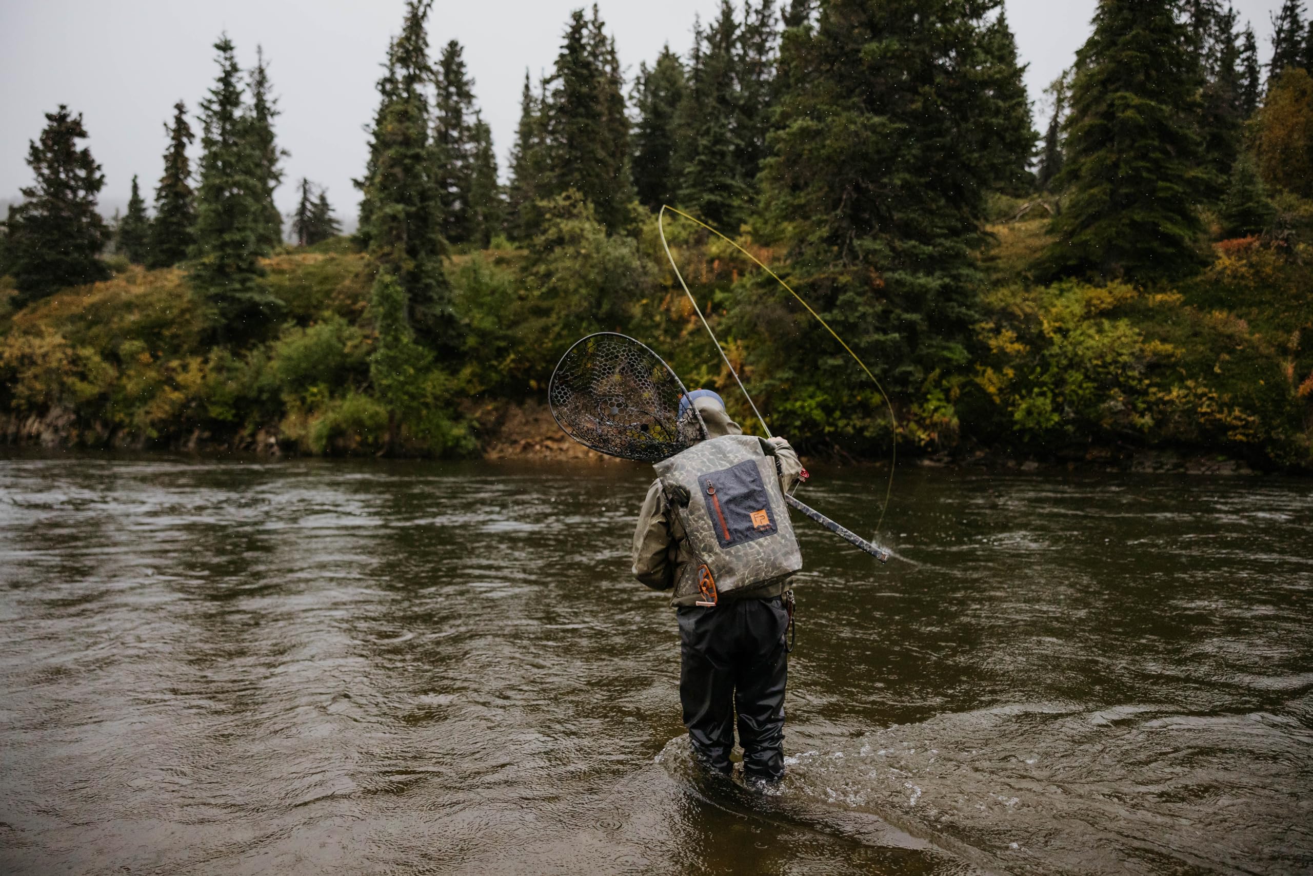 Fishpond Wind River Roll-Top Eco Shadowcast Camouflage keeps gear discreet on water