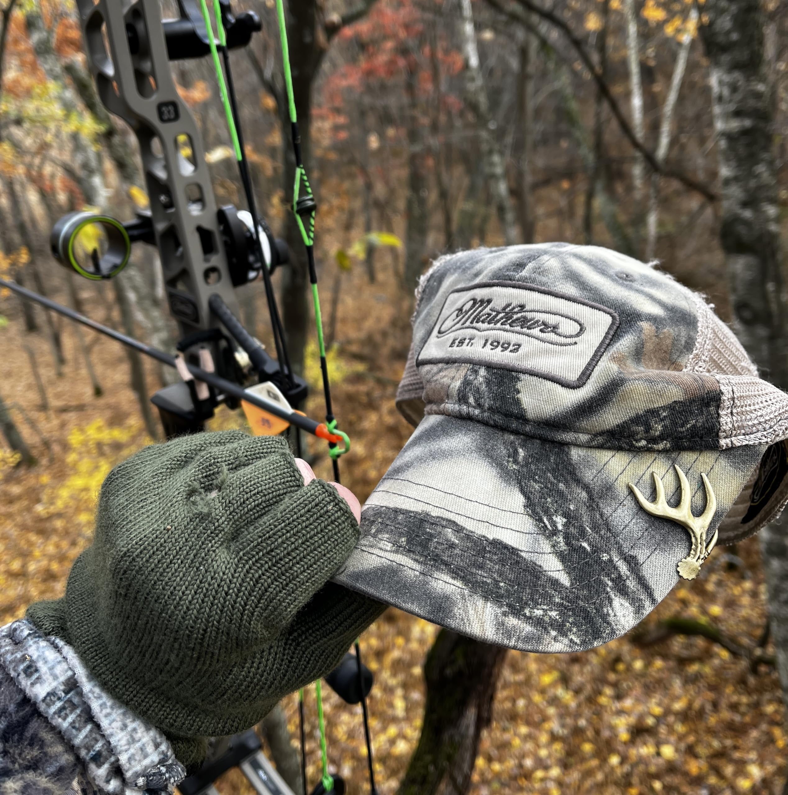 Bow hunter designed hat clip in action on a hat