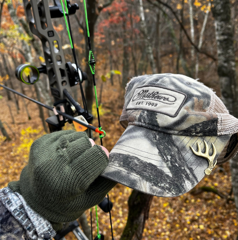 Bow hunter designed hat clip in action on a hat