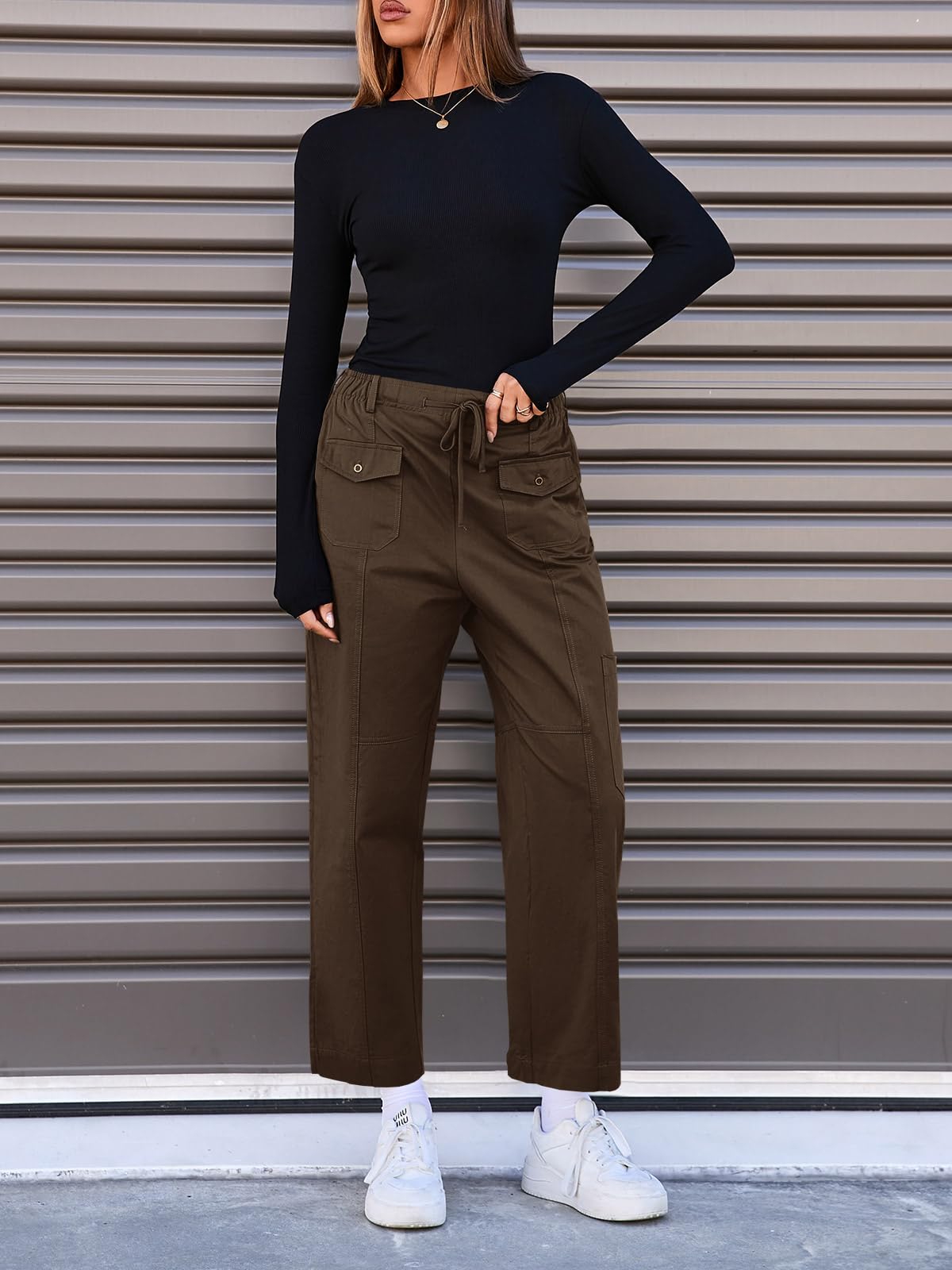 Fisoew cargo pants showing multiple pockets for practical storage on outdoor trips.