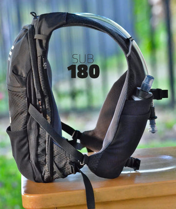 FITLY Sub180 soft flask in front pocket enabling quick sips.