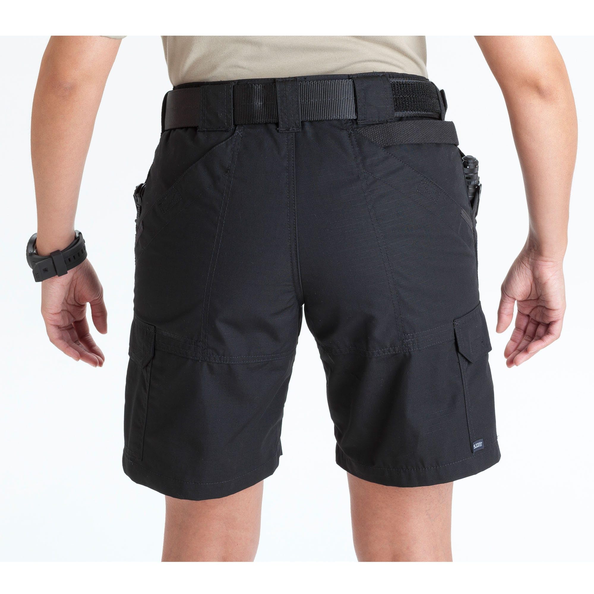 The 5.11 TACLITE Pro women's cargo shorts fabric closeup shows a durable DWR finish.