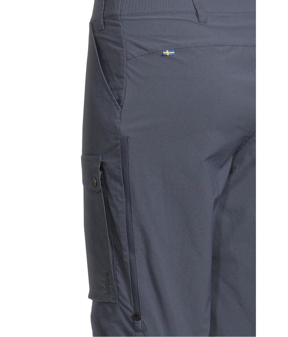 Fjällräven Abisko Hybrid Trail Trousers worn in forest scene demonstrating rugged fabric