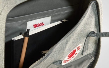 Fjällräven Kånken Re-Wool seat pad included for comfortable rests.
