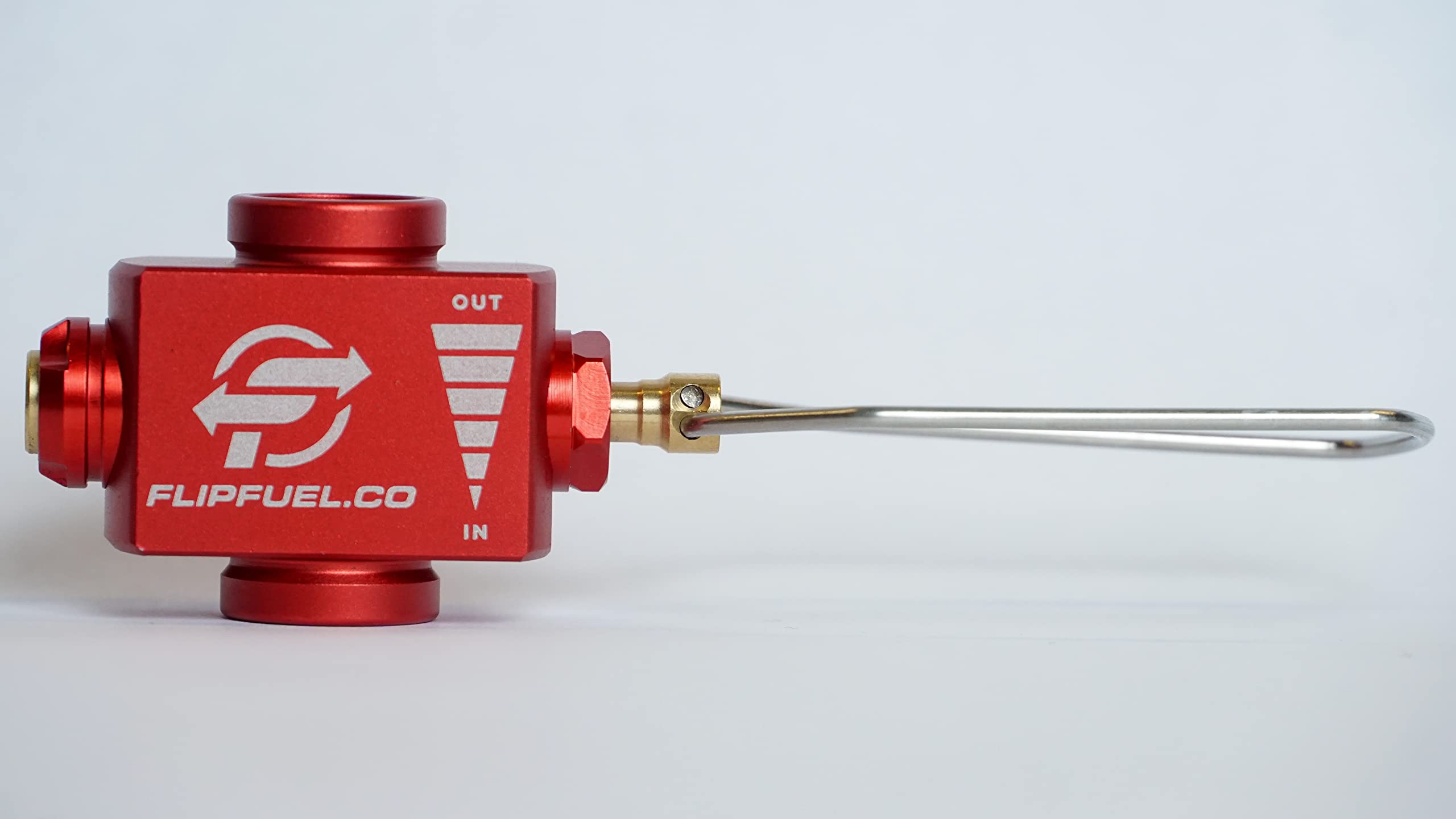 FlipFuel fuel transfer device closeup shows precise valve and aluminum body.
