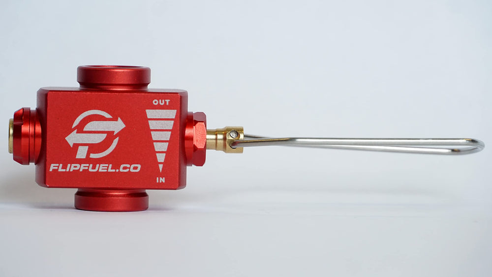 FlipFuel fuel transfer device closeup shows precise valve and aluminum body.