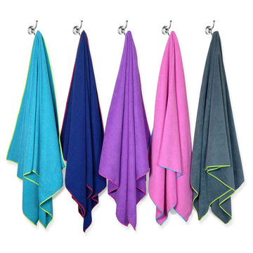 Flow Swim Gear towel in use for watersports like swimming and lake activities.