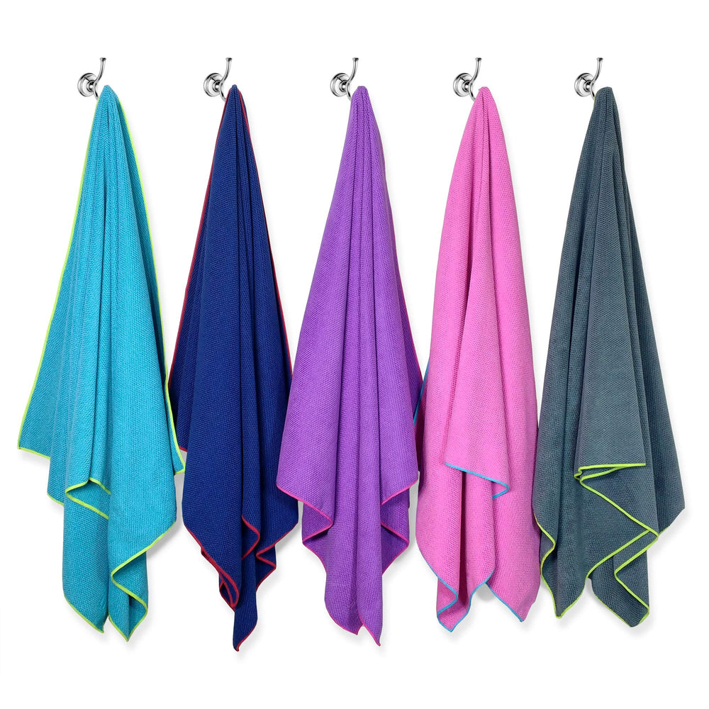 Flow Swim Gear towel in use for watersports like swimming and lake activities.