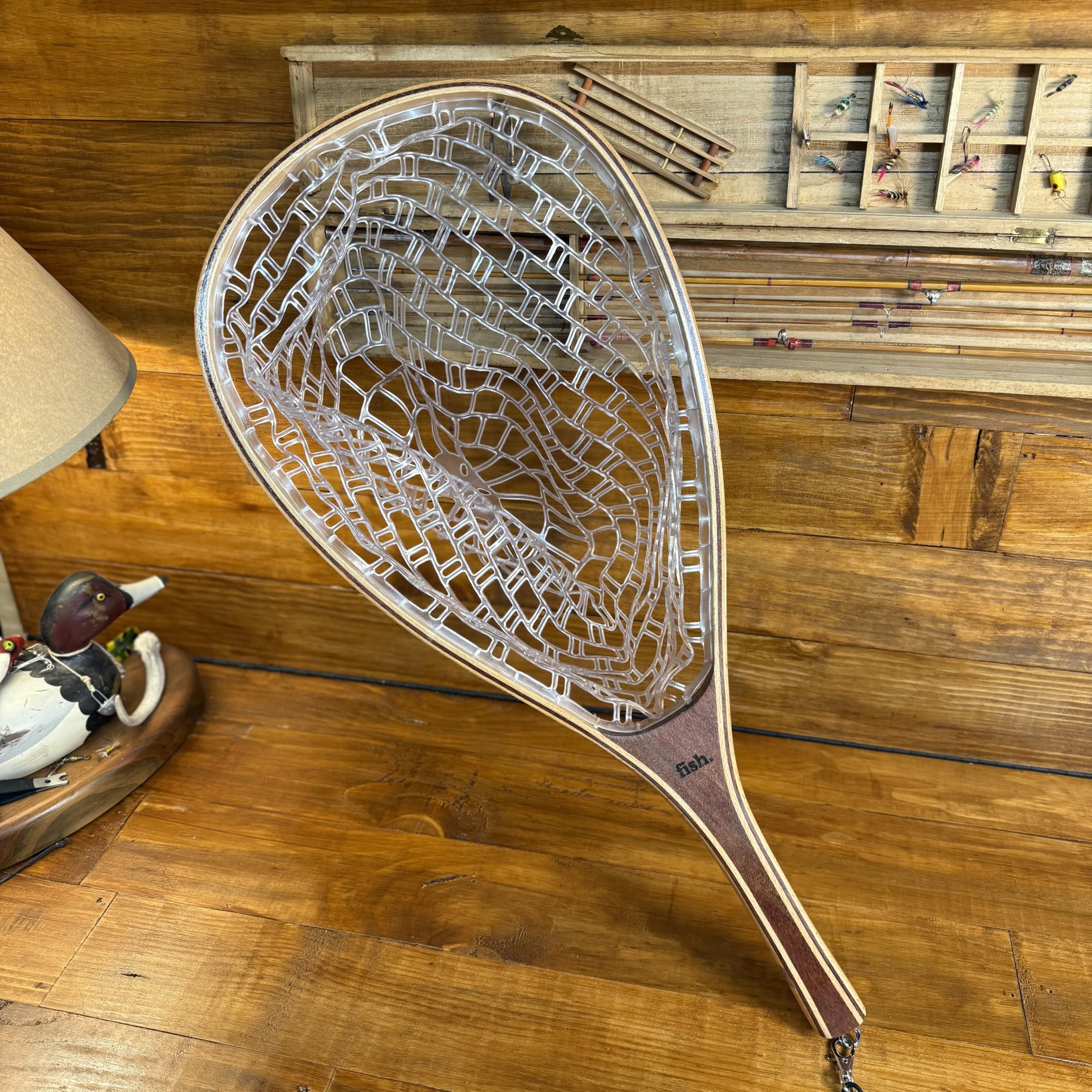 Close-up of the wooden handle on the landing net