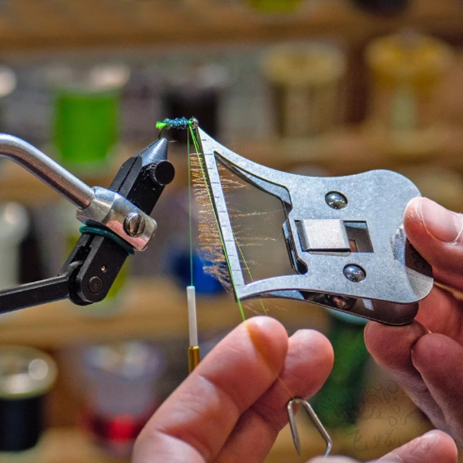Close-up of metal feather pliers for fly tying