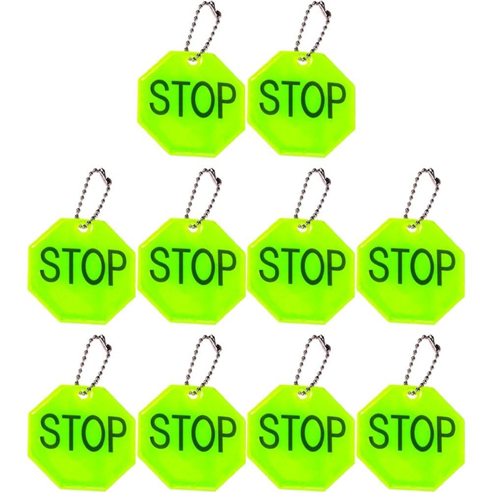 Fopytu STOP reflector pendant on backpack improves night visibility for safer commutes.