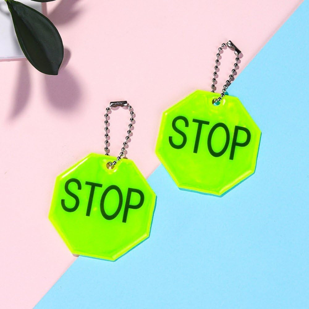 Fopytu STOP reflector pendant on bike increases dusk ride visibility for safer cycling.