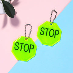 Fopytu STOP reflector pendant on bike increases dusk ride visibility for safer cycling.