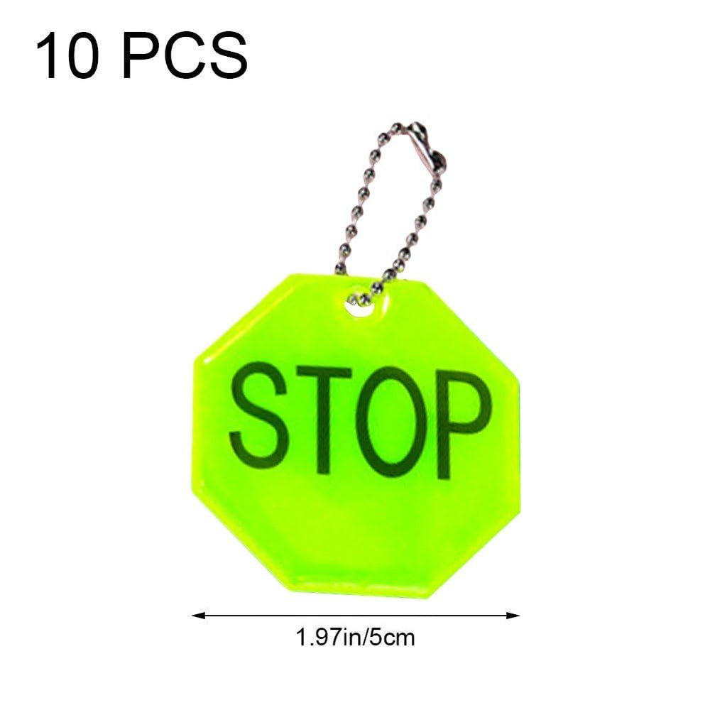 Fopytu STOP reflector pendant on purse helps items stand out at night for safety.