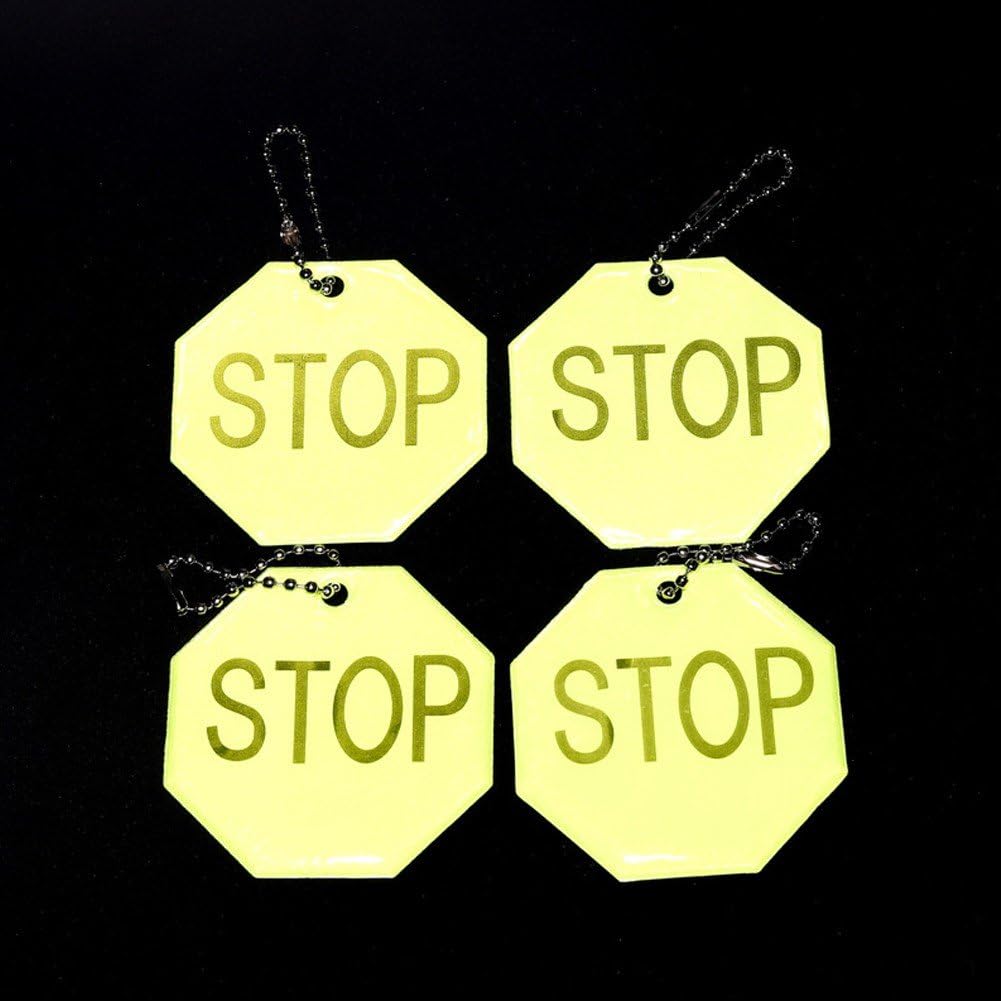 Fopytu STOP reflector pendant on school bag aids evening safety for students.