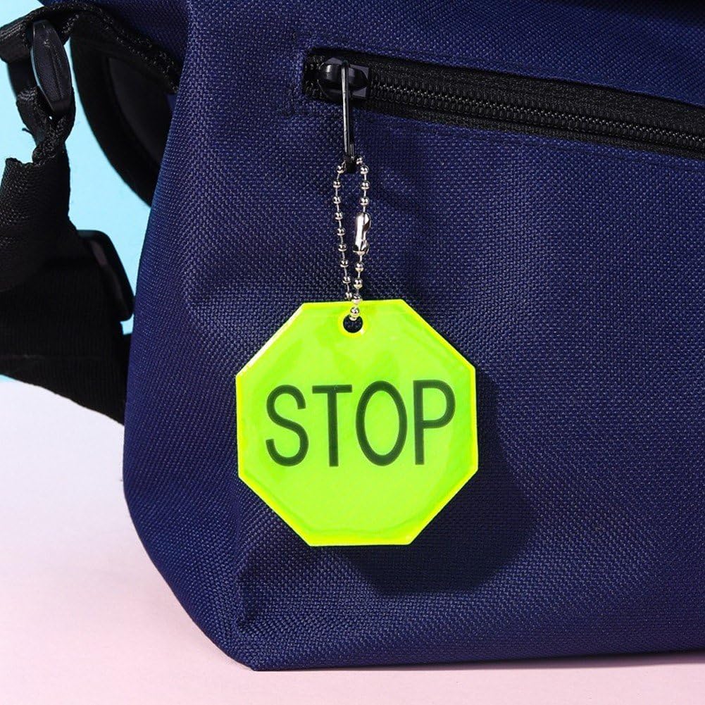 Fopytu STOP reflector pendant on wheelchair enhances visibility during early morning outings.