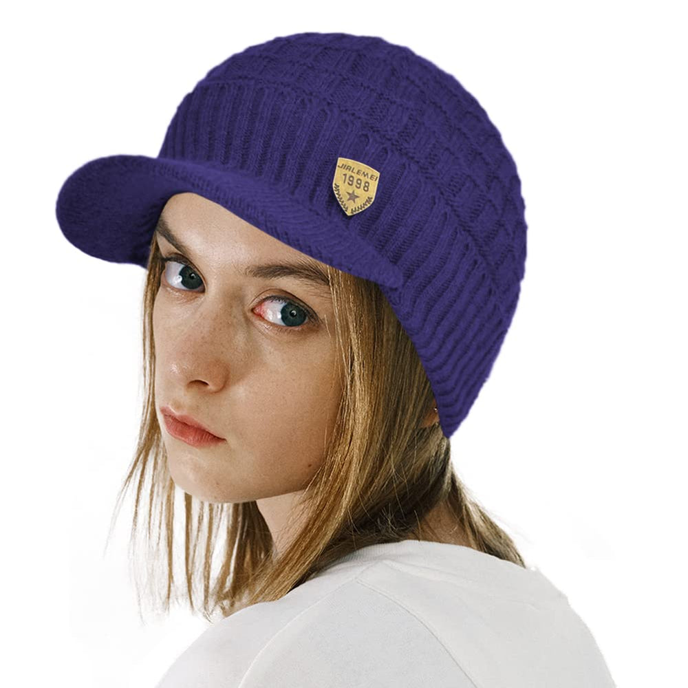 All-season blue visor beanie worn in city setting