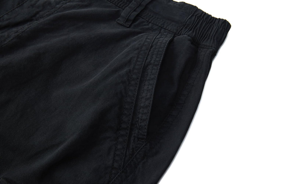 FOURSTEEDS cargo pants cargo pockets with flap and metal buttons.