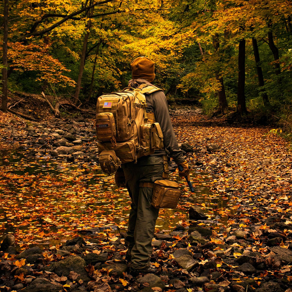 Fox Outdoor Products Advanced 3-Day Combat Pack bottom pocket keeps tools secure on rugged treks.