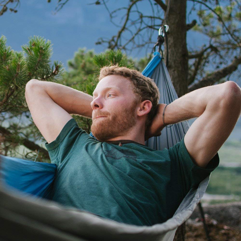 Fox Outfitters Neolite double hammock on beach for relaxed social time.