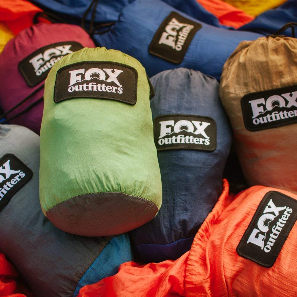 Fox Outfitters Neolite double hammock shows triple interlocking stitching on rugged terrain.