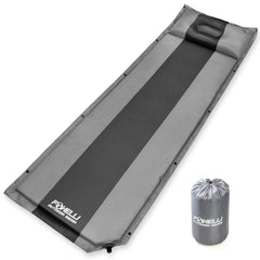 Foxelli self-inflating sleeping pad unrolled with rapid rise foam for easy setup.
