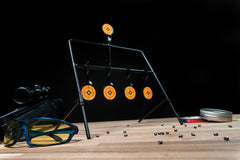 Frankford Arsenal Caldwell rimfire resetting target in use portable setup for range and hunting sessions