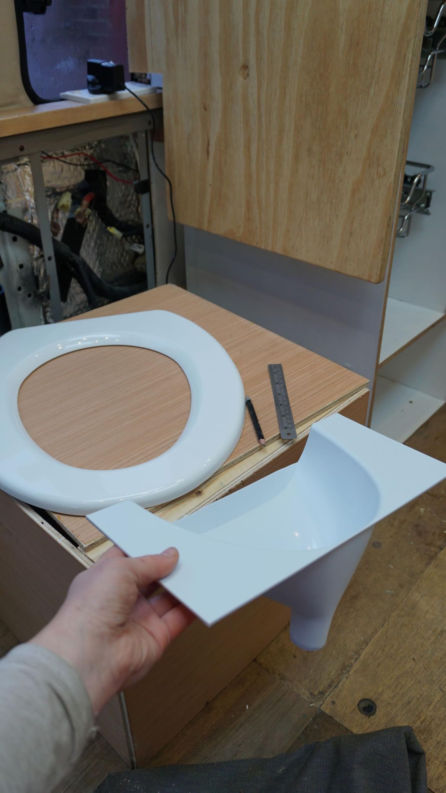 Free Range Designs urine diverter dry-solid-waste shows dry, odor-reducing solid waste.