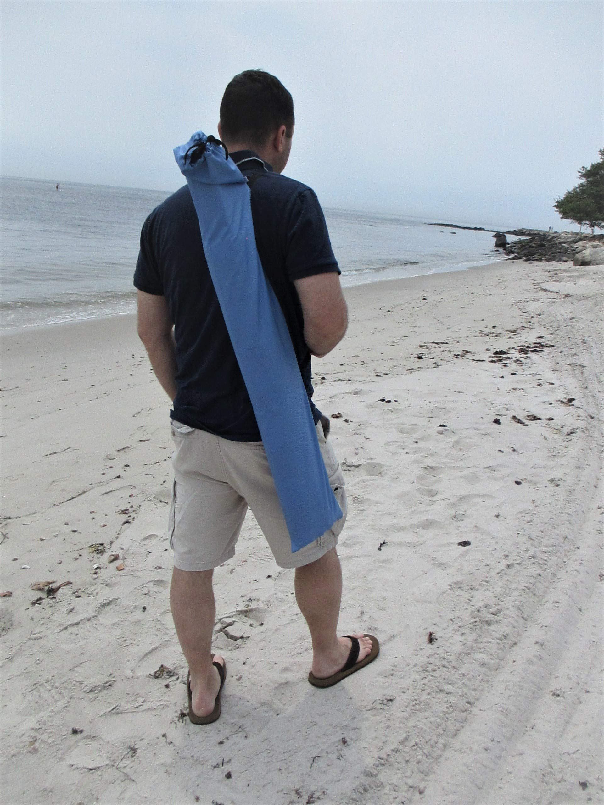 Windscreen privacy and sand control setup on a crowded beach