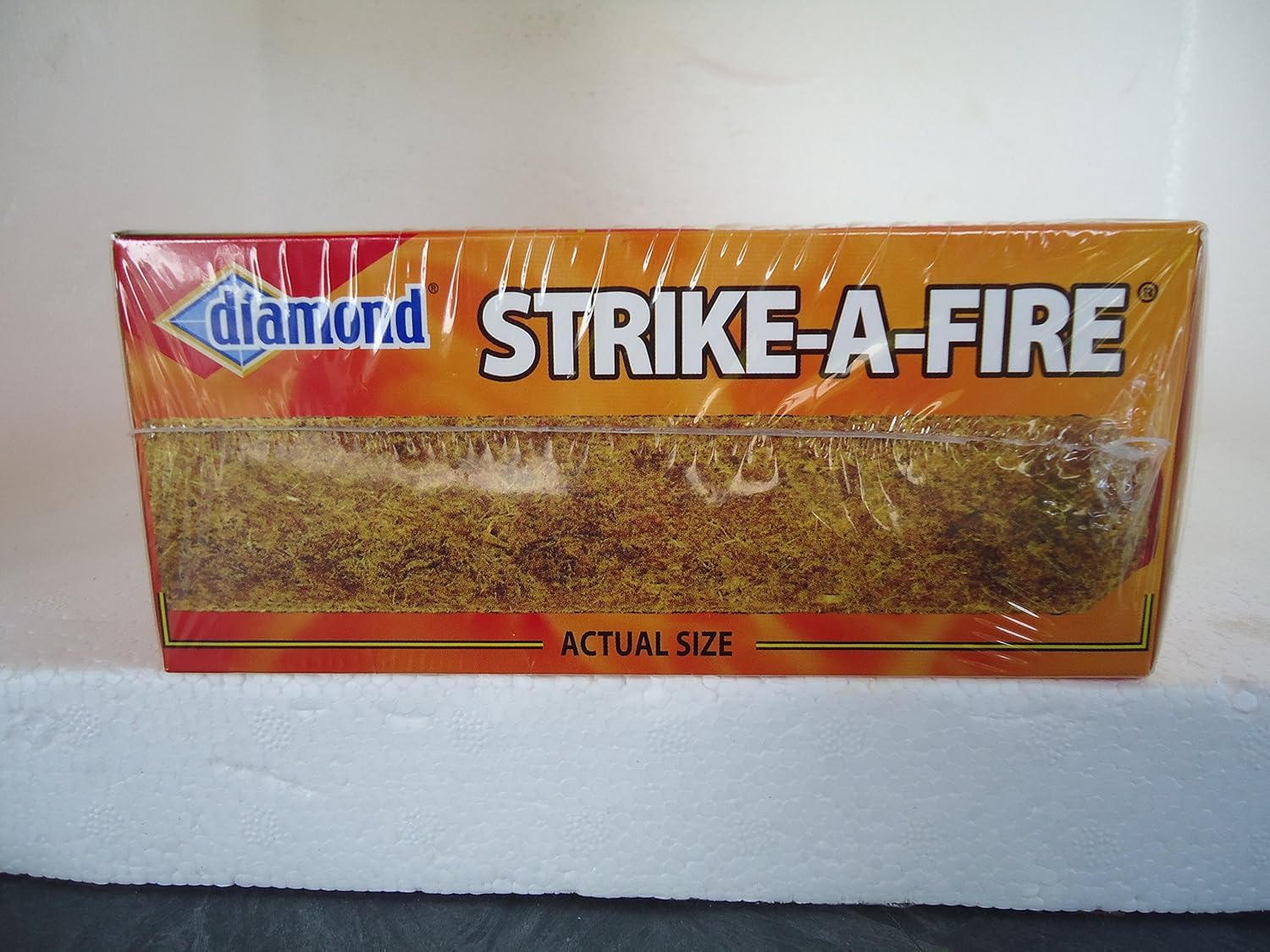 Frost Strike Fire Stick packaging back shows striker for quick ignition.