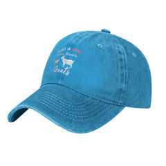 Goats-themed embroidery on blue cap, side view
