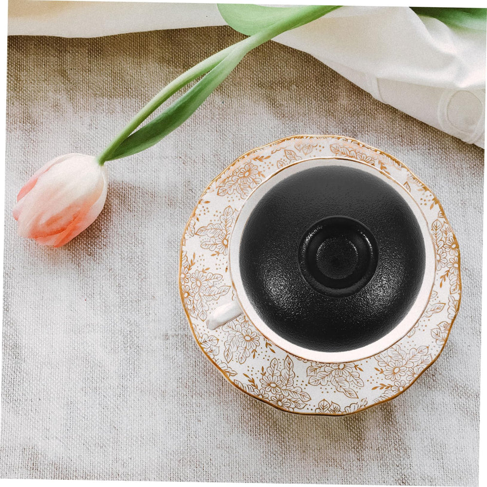 FUNOMOCYA retro teacup lid adds practical charm to tea time.