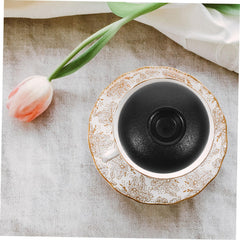 FUNOMOCYA retro teacup lid adds practical charm to tea time.