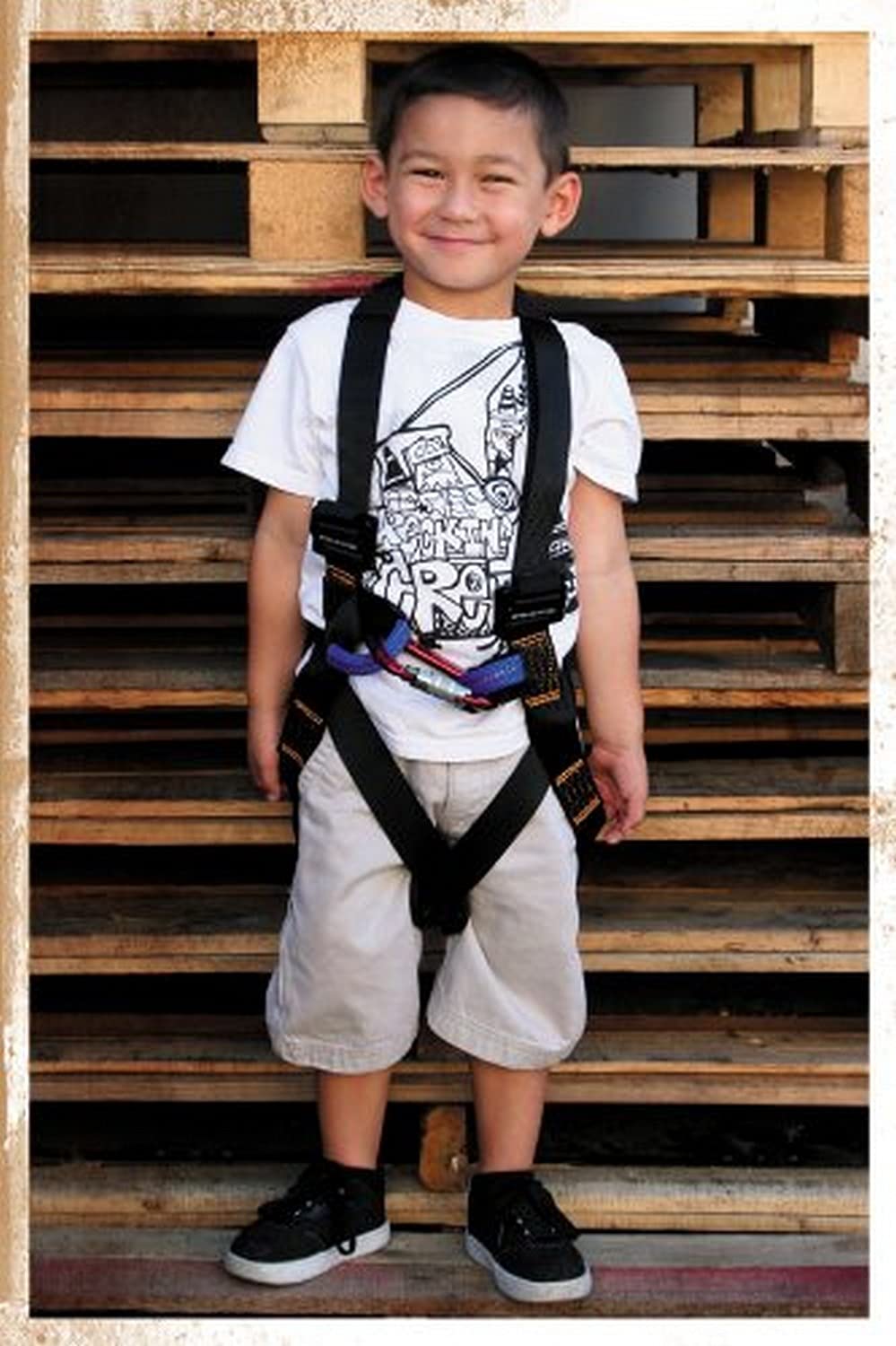 Fusion Warrior Kids full body harness black, front view, secure and comfortable for young climbers.