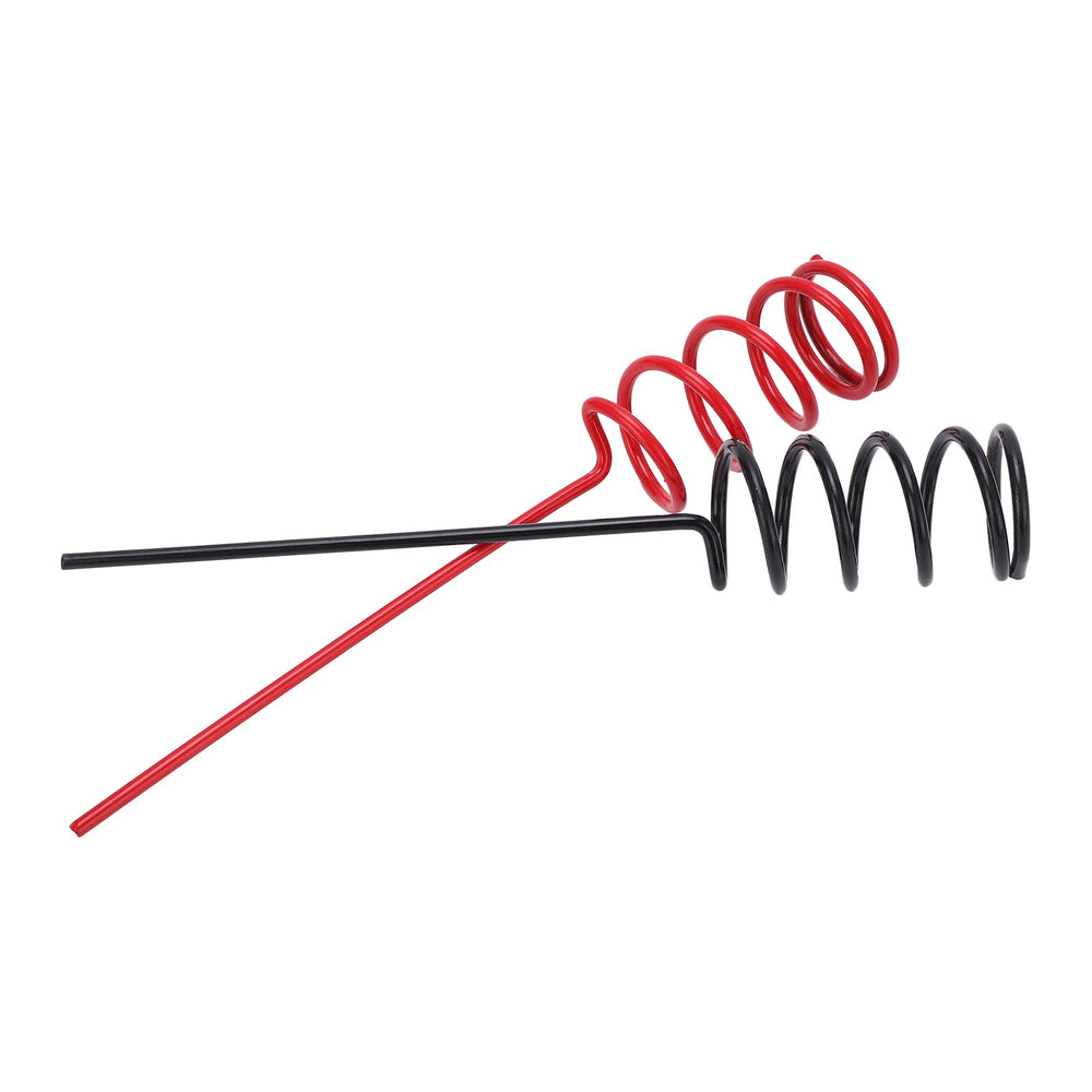 Pair of spiral rod stands set up for fishing on shore