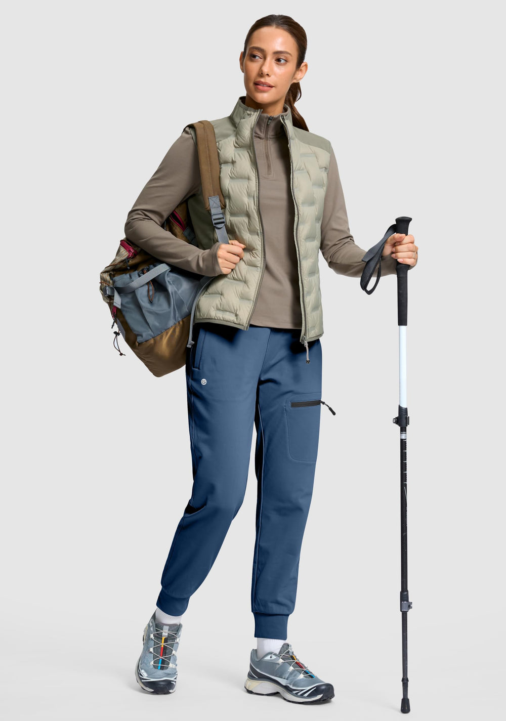 G Gradual women's fleece-lined joggers in-action on hiking trails.