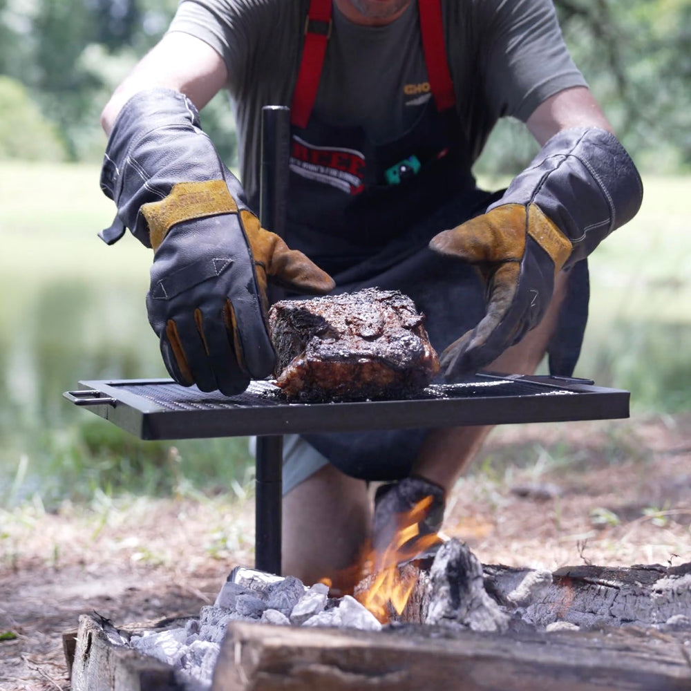 GameMaker gravity grill posts allow 360-degree rotation for versatile open-fire cooking.