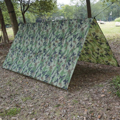 Gavigain camo bushcraft tarp setup offers shade and shelter for outdoor adventures.